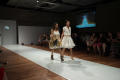 Primary view of [Models wearing fashion design student creations on runway]
