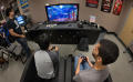 Thumbnail image of item number 1 in: '[Students playing video games during International Game Day event]'.