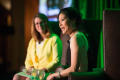 Photograph: [Sheryl WuDunn and Krys Boyd sitting on stage during the Literary Lig…