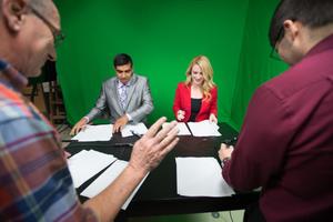Primary view of object titled '[NT Daily TV anchors going over scripts]'.