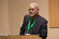 Primary view of [Charles Johnson at podium during keynote]
