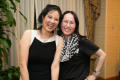 Photograph: [Sheryl WuDunn standing with a conference attendee]