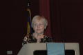 Photograph: [Woman speaking into mic during the 2006 CSLA conference]