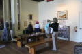 Thumbnail image of item number 1 in: '[Attendees touring Oregon Trail exhibit]'.