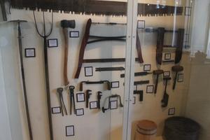 Primary view of object titled '[Wall of tools in exhibit]'.