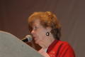 Photograph: [Woman speaking into mic at 2006 CSLA conference]