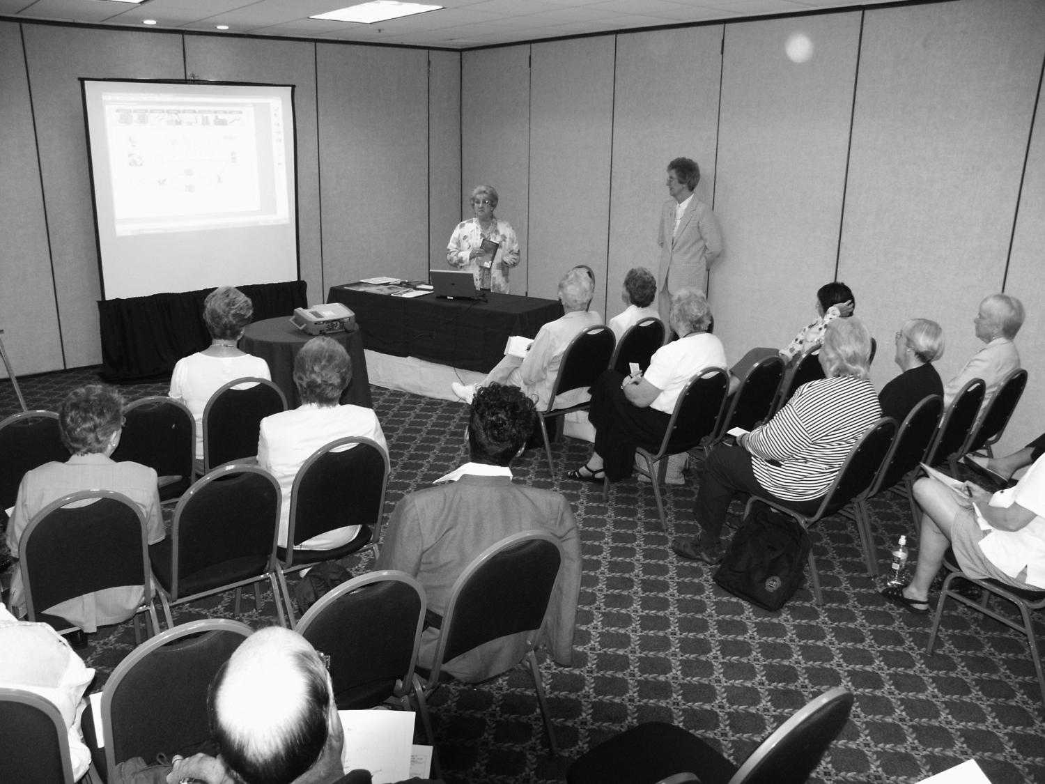 [Alrene Hall and Jane Hope workshop], Photograph of Alrene Hall and Jane Hope giving a workshop titled, "Concourse and EZCat: An Introduction" at the the 40th anniversary Church and Synagogue Library Association conference held at the Inn at Valley Forge in King of Prussia, Pennsylvania., 