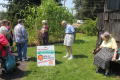 Thumbnail image of item number 1 in: '[Attendees standing in garden with guide]'.