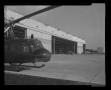 Photograph: [Photograph of the front end of a UH-1B Iroquois helicopter parked ou…