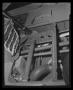 Photograph: [Photograph of mechanical components inside the floor of a UH-1B Iroq…