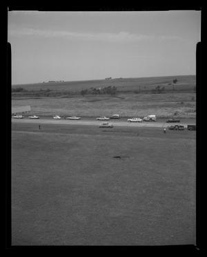 Primary view of object titled '[Photograph of a street and pastures, taken from above, 3]'.