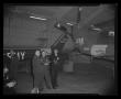 Photograph: [Photograph of men in suits standing by two aircraft]