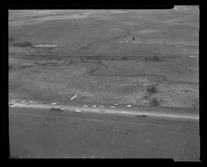 Primary view of object titled '[Photograph of a street and pastures, taken from above]'.