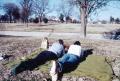Photograph: [Two people laying on a picnic blanket]