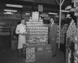 Photograph: [Two Men with Cans of "Ajax"]