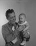 Photograph: [Bill Guy and Smiling Baby]