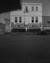 Photograph: [Exterior of the Johnnie Johnson store front, 2]