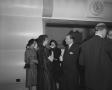 Photograph: [Small group of men and women socializing]