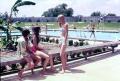 Photograph: [Girls talking near a swimming pool]