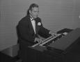 Photograph: [Bill Barclay playing an organ]