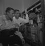 Photograph: [Two men with an opened IBM 1620, 2]