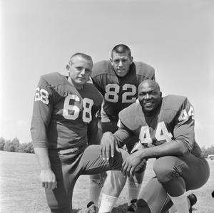 Primary view of object titled '[Three NTSU football players smiling, 3]'.