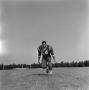 Photograph: [Football player running on the field, 53]