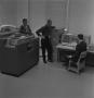 Photograph: [Three men and an IBM 1620 computer, 2]