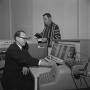 Photograph: [Two men and an IBM 1620]