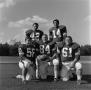 Photograph: [Five NTSU football players on the field, 2]