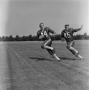 Photograph: [Football players running with balls, 2]