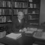 Photograph: [Dr. L.F. Connell at his desk, 16]