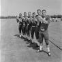 Photograph: [Six NTSU football players in a line, 2]