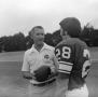 Photograph: [Football coach and a player, 3]