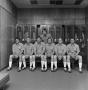 Photograph: [Football staff in a locker room]