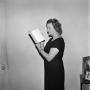 Photograph: [A woman staring at a book, 2]