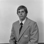 Photograph: [Football staff member in a suit]