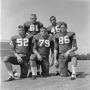 Photograph: [Five NTSU football players posing]