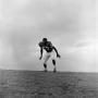 Photograph: [Football player on a hill, 8]