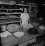 Photograph: [Woman in a kitchen, 2]