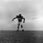 Photograph: [Football player on a hill, 9]