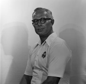 Primary view of object titled '[Football staff member wearing a polo]'.