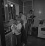 Primary view of [Coomes family in their kitchen, 3]