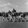 Photograph: [Five NTSU football players in position, 2]