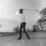Photograph: [Unknown man golfing]