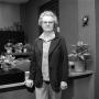 Photograph: [Louise Alton standing in office]