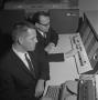 Photograph: [Two men with an IBM 1620]