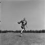 Photograph: [Football player running with the ball, 23]