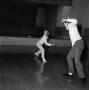 Photograph: [Fencing in an auditorium]