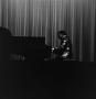 Photograph: [Louis Teicher playing the piano #1]